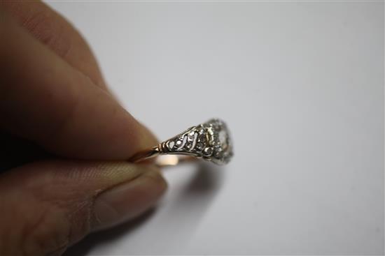 A Georgian gold, silver and diamond set cluster ring, size M/N.